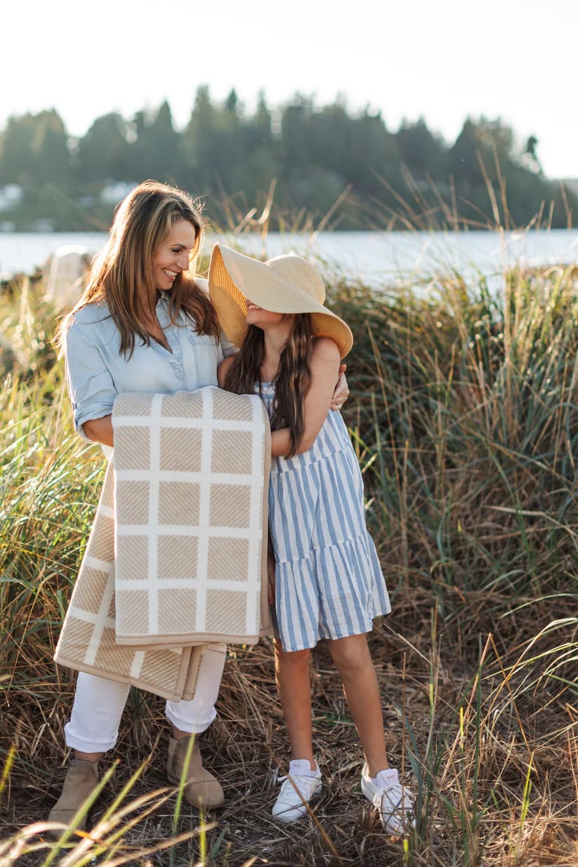 The Westerly Co Commodore blanket in soft cream and sand tones, is a perfect addition to a seaside picnic or just thrown over a chair at home.