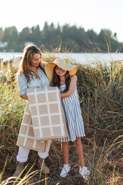 Wrap yourself, or a loved one, in the Westerly Co Commodore blanket. It's soft cream and sand tones are a perfect addition to a seaside picnic or just thrown over your favorite chair at home.